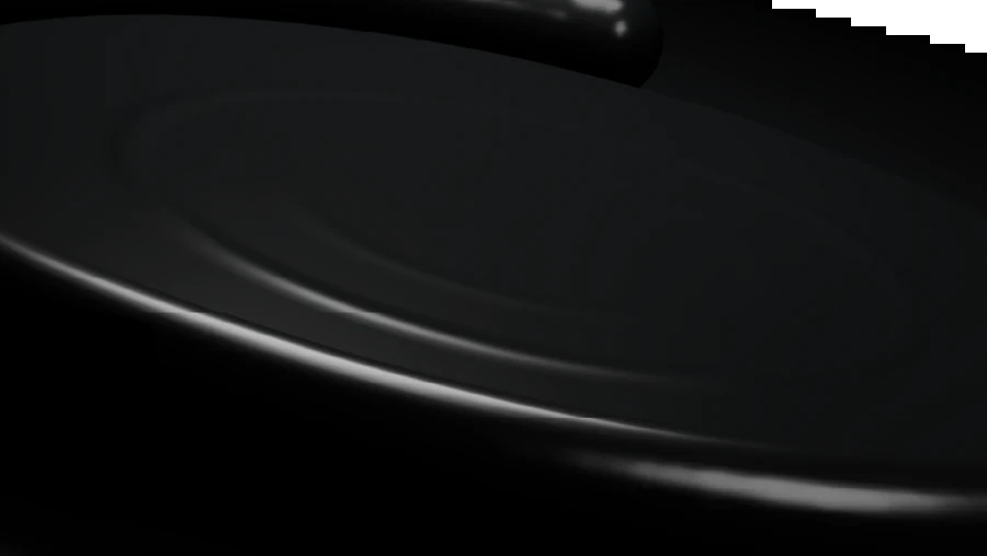 Macro black prepaid-card edge with a reflective metallic highlight