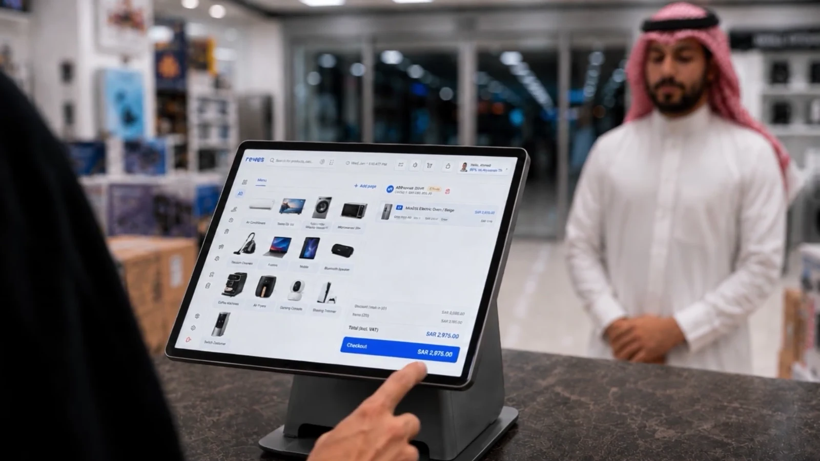 Close view of a customer completing a purchase on the Revest point-of-sale terminal